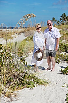 Happy senior couple beach vacation