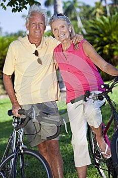 Happy Senior Couple on Bicycles In A Park