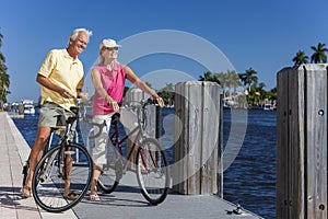 Happy Senior Couple on Bicycles By a River