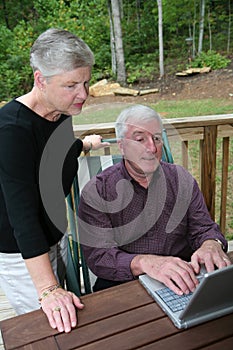 Happy Senior Couple on Computer