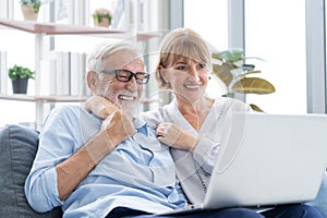 Happy senior couple, elderly family, caucasians mature, adult lover and retired man, woman using laptop computer shopping online,