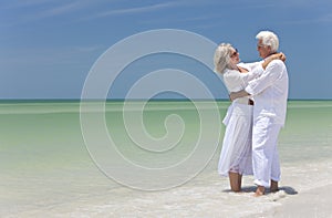 Happy Senior Couple Embracing on A Tropical Beach