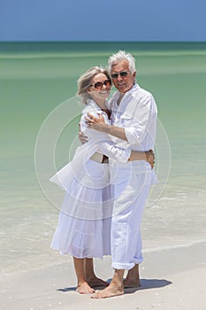 Happy Senior Couple Embracing on Tropical Beach