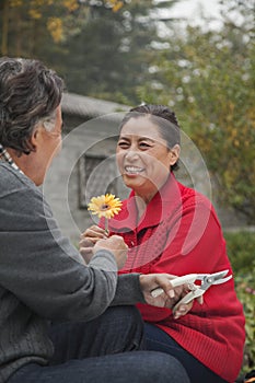 Happy Senior couple with flower