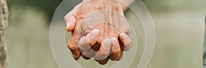 happy senior couple holding hands. hands of man and woman hold each other. romance and love and support in elderly family. faceles