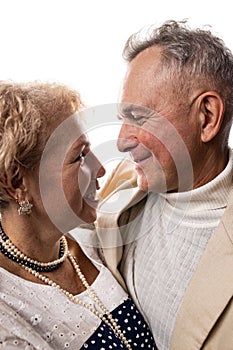 Happy senior couple in love. Close-up portrait of a happy senior couple looking at each other.