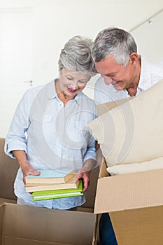 Happy senior couple moving into new home