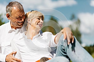 Happy senior couple outdoors in spring