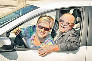 Happy senior couple ready for a car trip