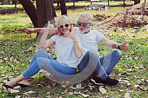 Happy senior couple relax in the park