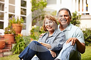 Happy senior couple relaxing in garden