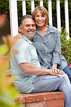 Happy senior couple relaxing in garden