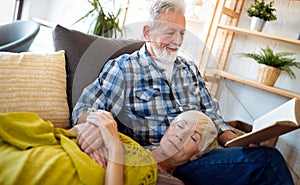 Happy senior couple relaxing at home together