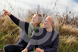 Happy senior couple relaxing together in the sunshine