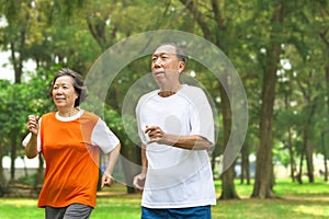 Happy senior couple running together