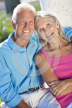 Happy Senior Couple Smiling Outside in Sunshine