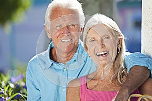 Happy Senior Couple Smiling Outside in Sunshine