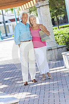 Happy Senior Couple Smiling Outside in Sunshine