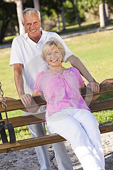 Happy Senior Couple Smiling On Park Bench