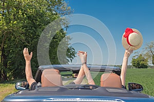 Happy senior couple in sports car