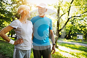 Happy senior couple staying fit by sport running