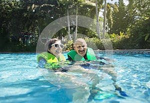 Happy Senior couple swimming together on a lazy river