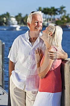 Happy Senior Couple On Vacation By Tropical Sea