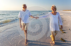 Happy Senior Couple Walking Holding Hands Tropical Beach