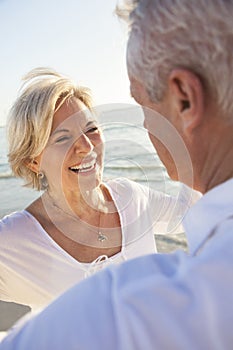 Happy Senior Couple Walking Holding Hands Tropical Beach