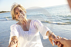 Happy Senior Couple Walking Holding Hands Tropical Beach