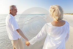 Happy Senior Couple Walking Holding Hands Tropical Beach