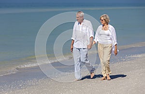 Happy Senior Couple Walking Holding Hands Tropical Beach