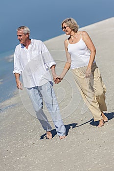 Happy Senior Couple Walking Holding Hands Tropical Beach