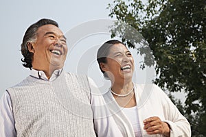 Happy senior couple walking outdoors in Beijing