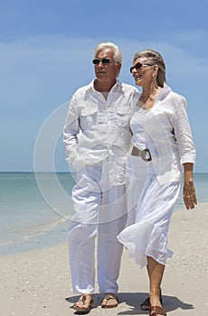 Happy Senior Couple Walking by Sea on Tropical Beach