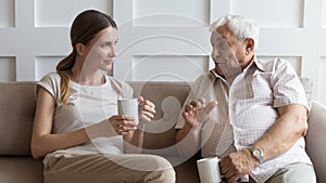 Happy senior dad and adult daughter enjoy weekend together