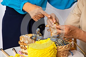 Happy senior elder woman teaching knitting woven craft other old female mature togehter at home