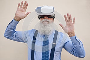 Happy senior hipster man using 3d virtual reality headset - Focus on vr goggles