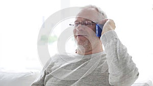 Happy senior man calling on smartphone at home 22