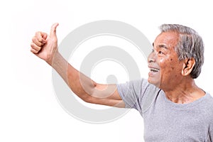 Happy senior man giving thumb up gesture