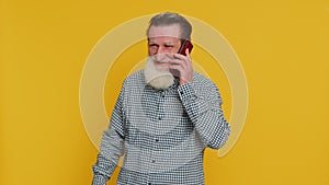 Happy senior man involved in pleasant conversation phone call good news enjoying talking gossip