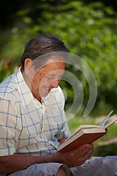 Happy senior man reading