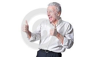 Happy senior man showing thumbs up isolated on white background