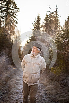 Happy senior man walking outside