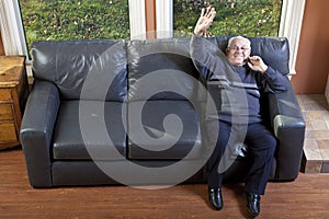 Happy senior man waving photo