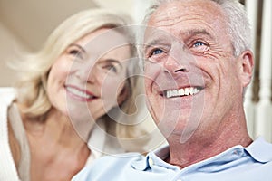 Happy Senior Man & Woman Couple Smiling at Home photo