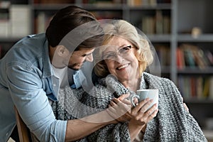 Happy senior mother enjoy weekend time with adult son