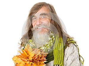 Happy Senior old man holding autumn yellow maple leaves