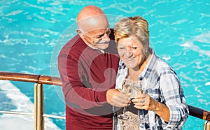 Happy senior retired couple having fun outdoors at travel vacation