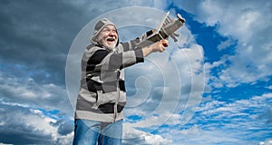 happy senior retired man. mature man at retirement. old man high on sky background with toy plane